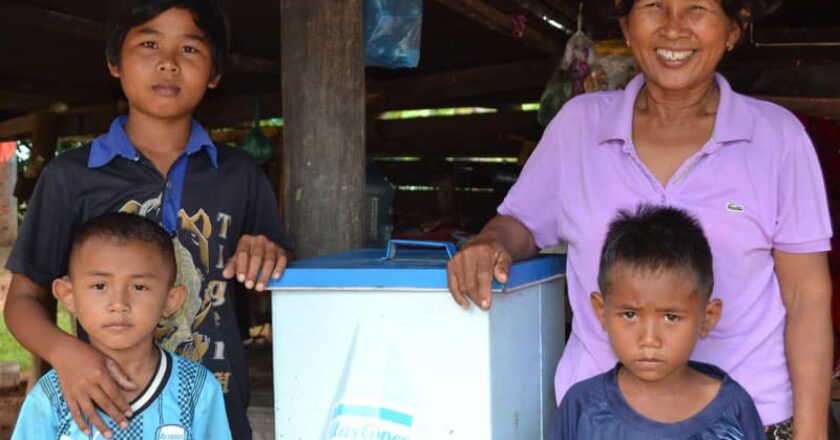 Happy Cambodian recipients of an Atlas Copco bio sand filter.
