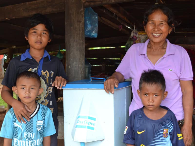 Happy Cambodian recipients of an Atlas Copco bio sand filter.