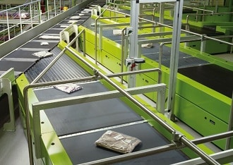 Beumer presented its belt tray sorter with various modules in action at CeMAT