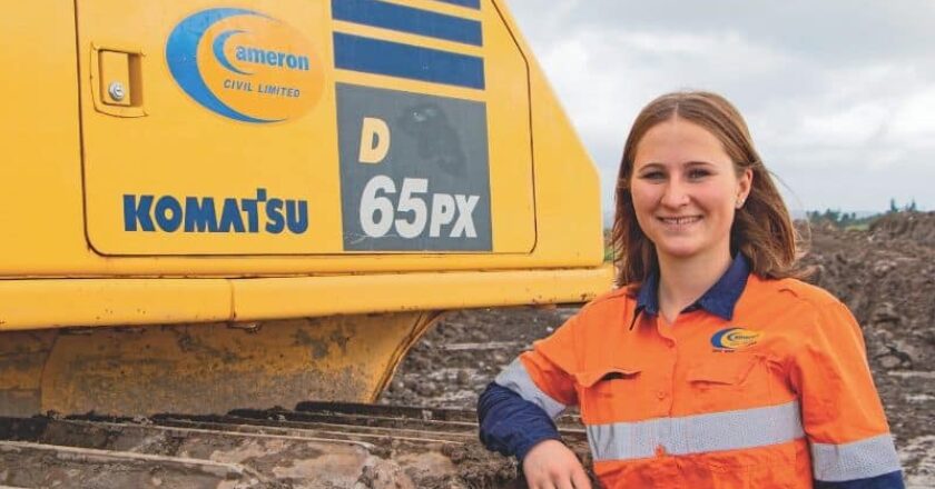Katie Wilson alongside her Komatsu D65PX-17 dozer