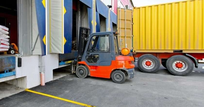 Forklift and truck at loading dock
