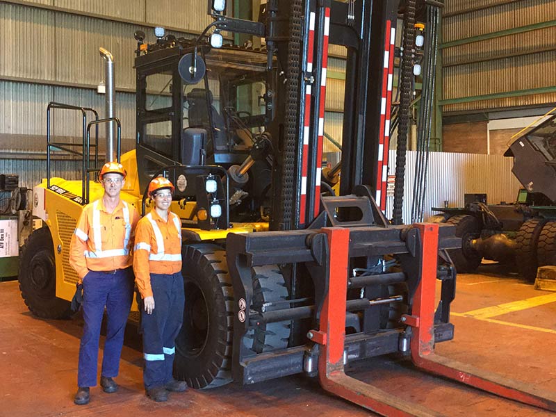 Robert Faehringer and Amy Chetcuti with their Sany SCP160C container forklift.