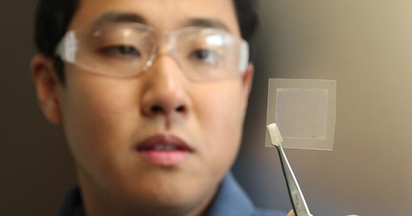 CSIRO Scientist Dr Dong Han Seo holds a piece of graphene film
