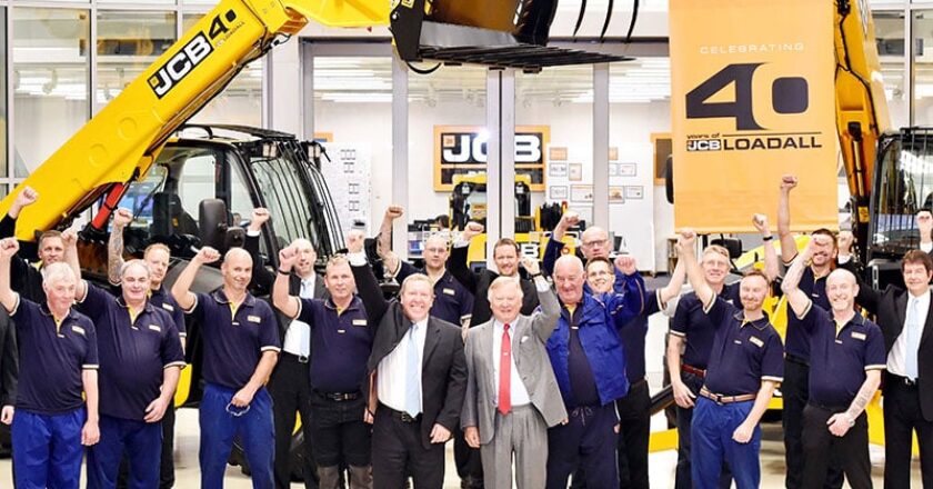 JCB Chairman Lord Bamford leads the cheers to celebrate the JCB Loadall's 40th anniversary