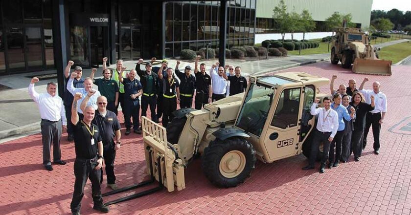 Staff at JCB HQ in the UK celebrate news of the historic order