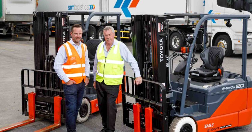 SRT Logistics CEO Rob Miller (left) with TMHA Hobart area sales manager, Rodney Jones, and the first of 36 new Toyota Material Handling forklifts and pallet jacks