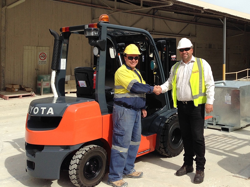 Andrew Schneider (left) and TMHA's Richard Bopping with Sibelco's highly specified new Toyota 8-FD25 forklift.