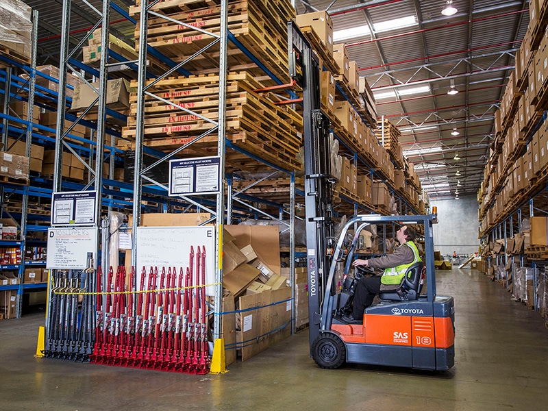 A Toyota 7FBE18 three-wheel forklift at work in the ARB warehouse.