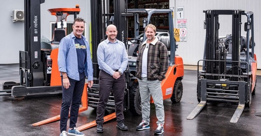 Colin Burdle, Danny Carbery and Shane Roberts with Funky Monkey Bars' fleet of forklifts